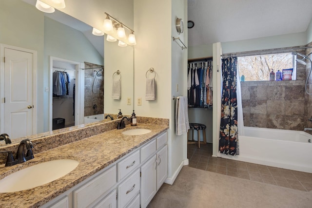 full bath featuring double vanity, tile patterned floors, shower / tub combo with curtain, and a sink