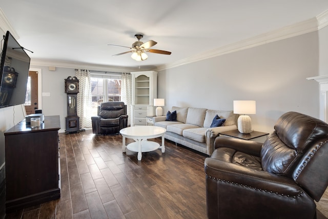 living room featuring dark wood-type flooring, crown molding, and a ceiling fan