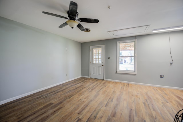 entryway featuring wood finished floors, baseboards, and ceiling fan