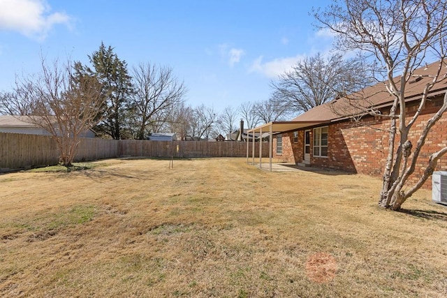 view of yard with a patio and a fenced backyard