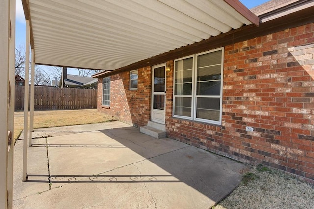 view of patio / terrace with entry steps and fence