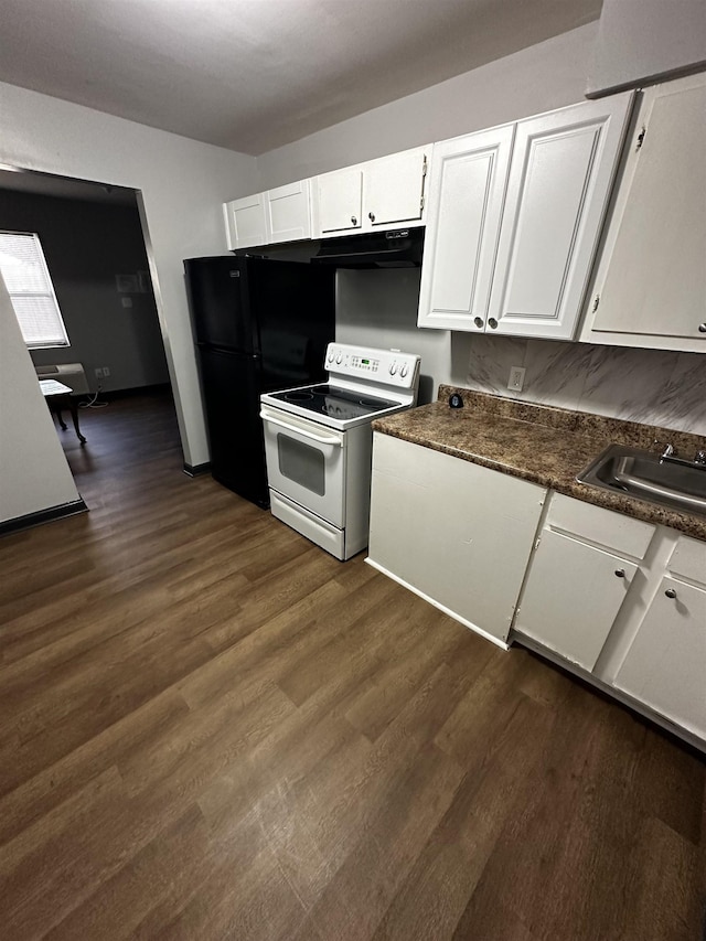 kitchen with dark wood-style floors, white cabinets, white electric range, and a sink