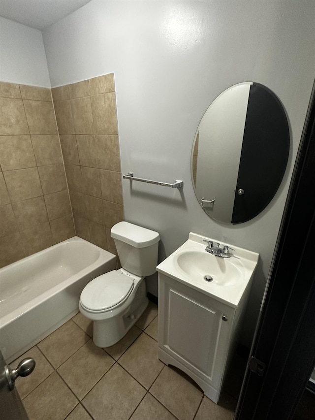 bathroom with tile patterned floors, toilet, and vanity