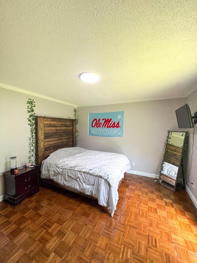 bedroom with a textured ceiling, baseboards, and ornamental molding