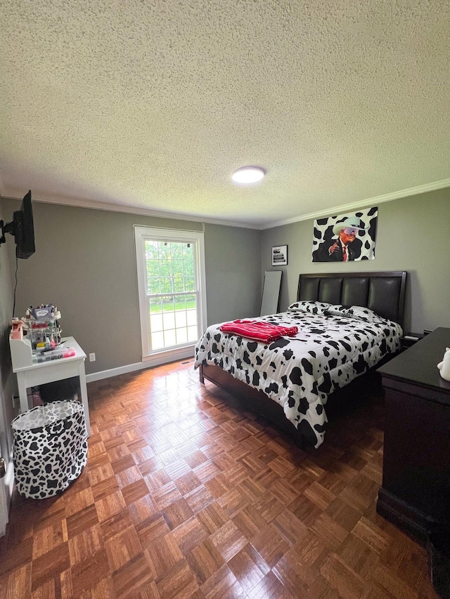 bedroom with a textured ceiling and crown molding