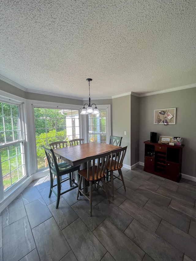 dining area featuring baseboards, a notable chandelier, and crown molding