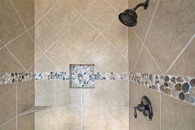 details featuring a tile shower