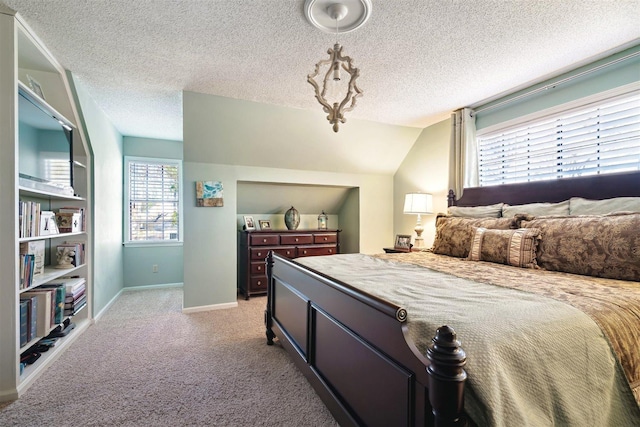 bedroom with light colored carpet, a textured ceiling, baseboards, and vaulted ceiling