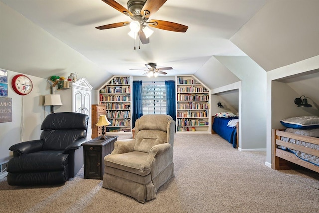 living area with built in features, baseboards, ceiling fan, vaulted ceiling, and light colored carpet