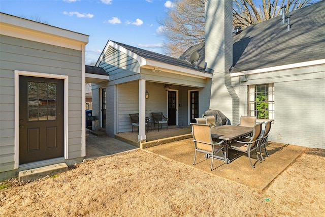 view of patio / terrace featuring outdoor dining area and ceiling fan