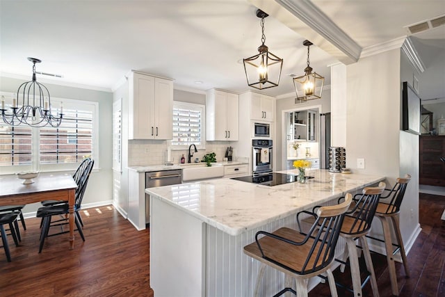 kitchen featuring an inviting chandelier, stainless steel oven, black electric cooktop, and built in microwave