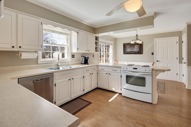 kitchen featuring a sink, stainless steel dishwasher, white electric range oven, a peninsula, and crown molding