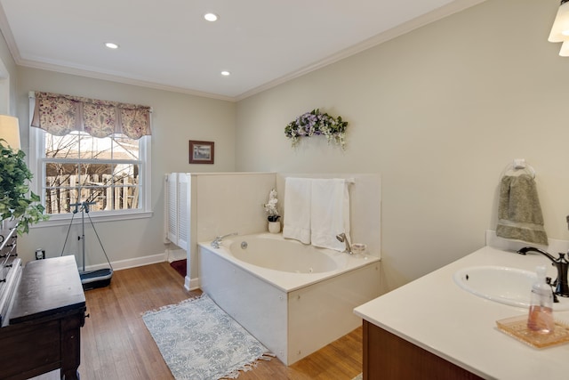 full bath with ornamental molding, wood finished floors, recessed lighting, baseboards, and a bath