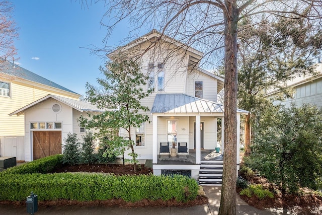 view of front of property featuring metal roof and covered porch