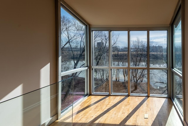 unfurnished sunroom with a healthy amount of sunlight