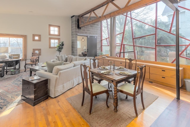 dining space featuring light wood-type flooring