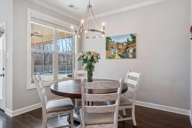 dining space with visible vents, a notable chandelier, wood finished floors, crown molding, and baseboards