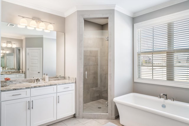 bathroom with visible vents, plenty of natural light, a stall shower, and ornamental molding