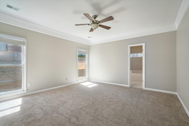 unfurnished room featuring ceiling fan, baseboards, visible vents, and ornamental molding