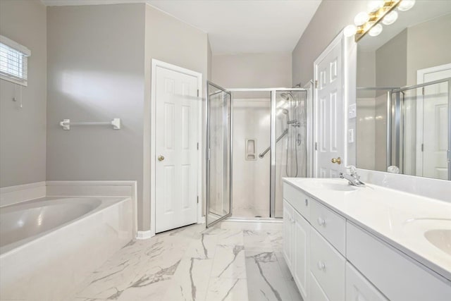 bathroom with a bath, a shower stall, double vanity, and a sink