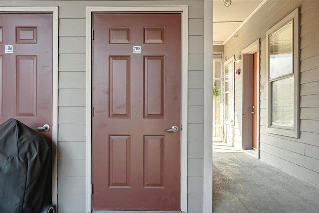 doorway to property with covered porch