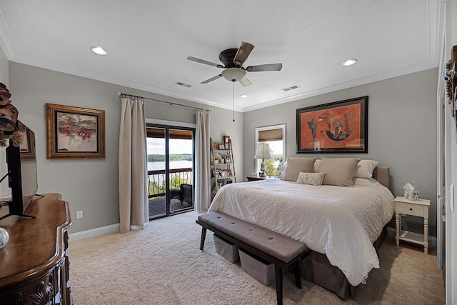 carpeted bedroom featuring visible vents, baseboards, ornamental molding, and access to outside