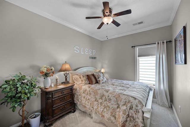 bedroom with crown molding, visible vents, and light carpet