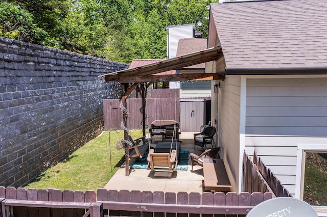 wooden terrace with a lawn, a fenced backyard, and outdoor lounge area