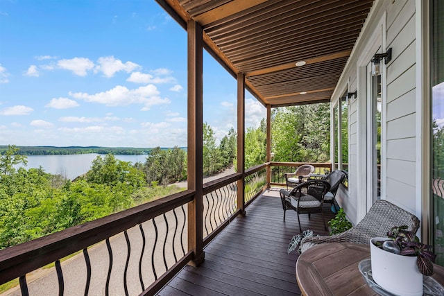 wooden deck with a water view