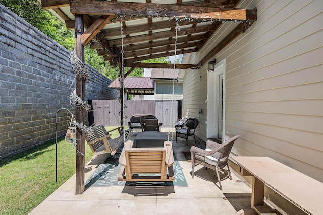 view of patio / terrace featuring outdoor lounge area and fence