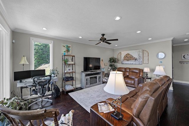 living area with baseboards, dark wood-style flooring, a ceiling fan, and ornamental molding