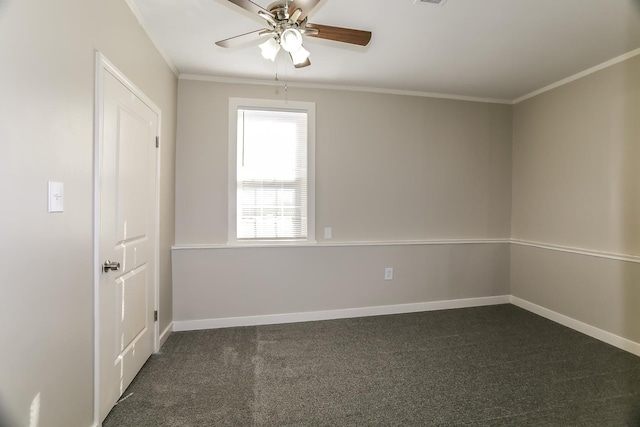 empty room featuring dark carpet, baseboards, a ceiling fan, and crown molding