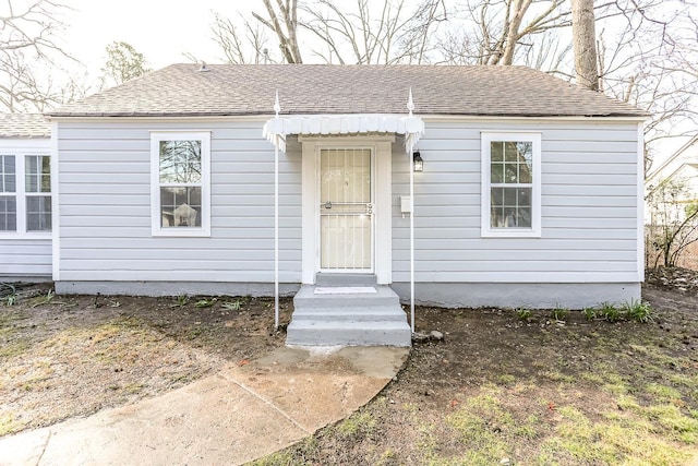 view of front of house featuring a shingled roof