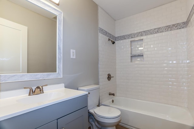 bathroom featuring vanity, bathing tub / shower combination, and toilet