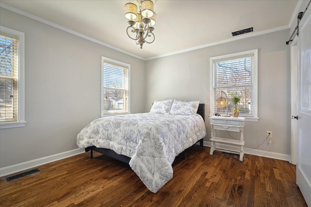 bedroom with visible vents, dark wood-type flooring, baseboards, and ornamental molding