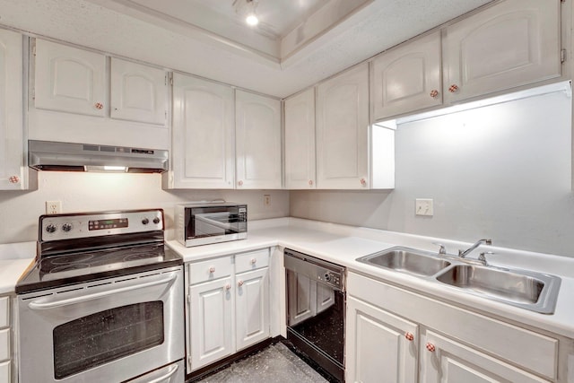 kitchen featuring under cabinet range hood, light countertops, white cabinets, stainless steel appliances, and a sink