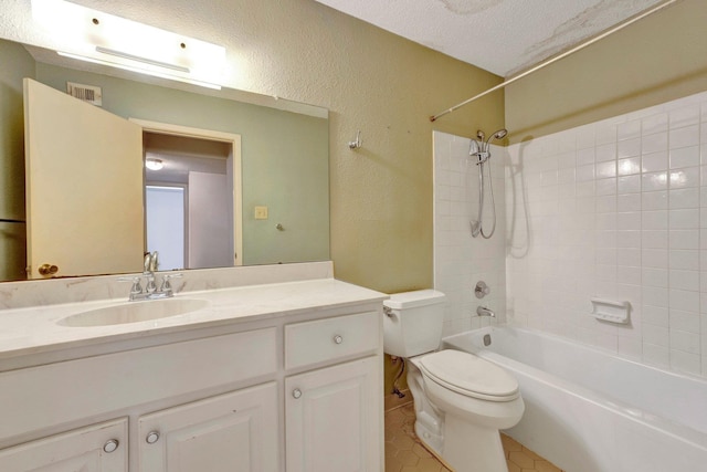 full bathroom featuring visible vents, toilet, a textured ceiling, vanity, and a textured wall