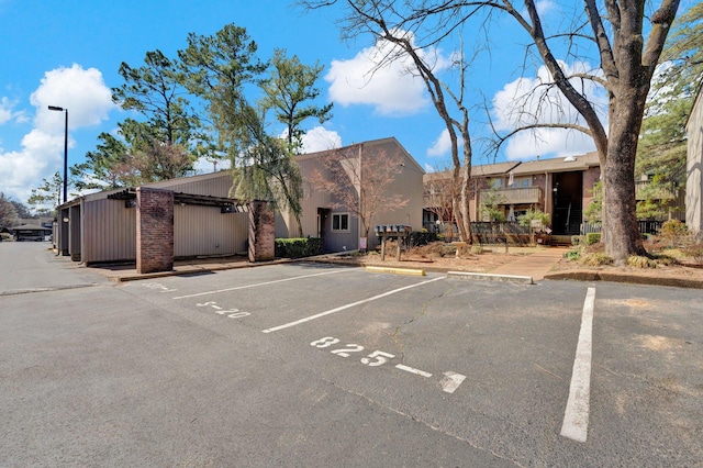 view of property with uncovered parking