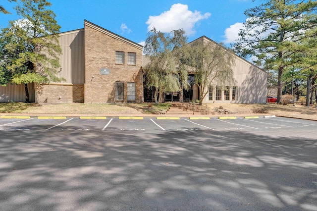 view of property with uncovered parking