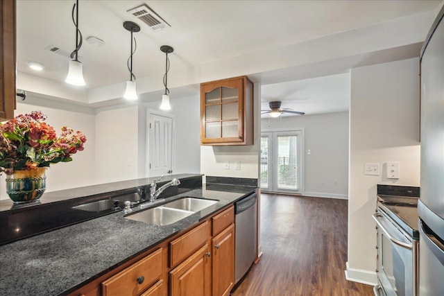 kitchen featuring visible vents, brown cabinets, appliances with stainless steel finishes, and a ceiling fan