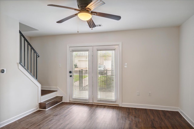 doorway with stairs, baseboards, and wood finished floors