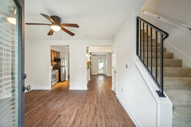 entrance foyer featuring stairs, baseboards, wood finished floors, and a ceiling fan