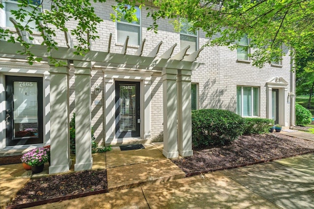 entrance to property with brick siding