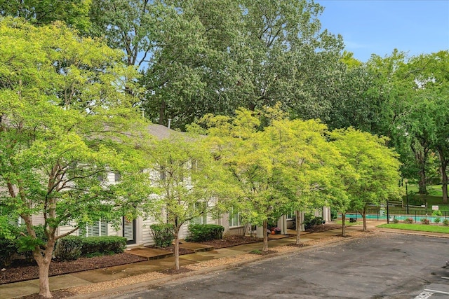 view of home's community with fence