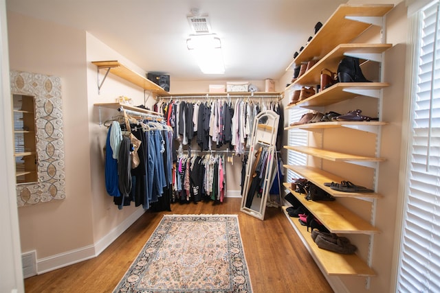 spacious closet with wood finished floors and visible vents