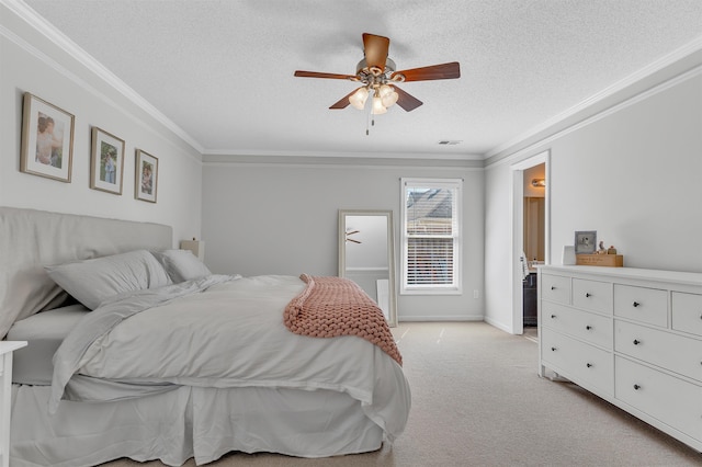 bedroom with visible vents, a textured ceiling, crown molding, baseboards, and light colored carpet