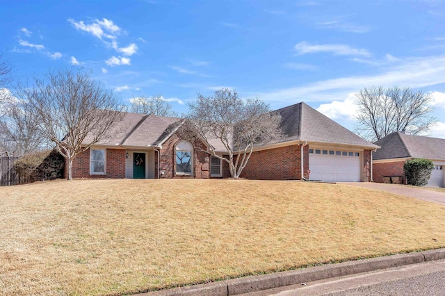 ranch-style house with brick siding, a front lawn, a garage, and a shingled roof