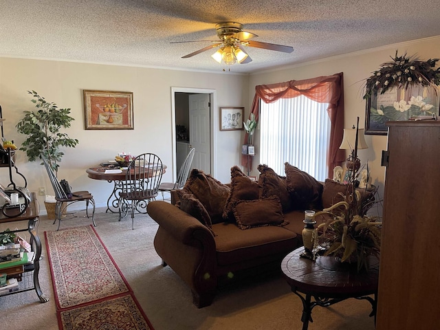 carpeted living room featuring a textured ceiling, a ceiling fan, and crown molding