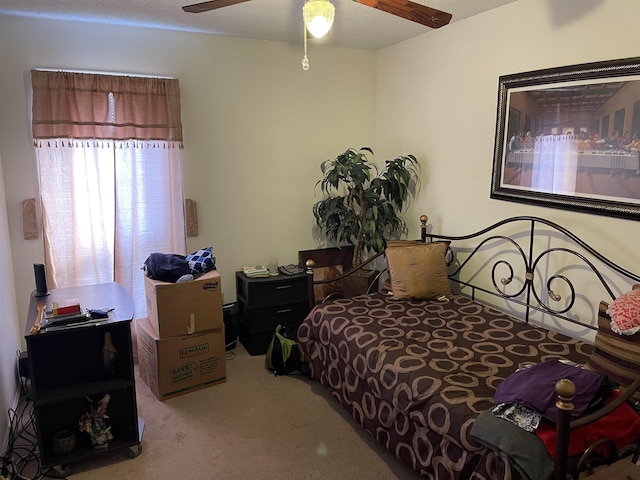 bedroom featuring carpet and a ceiling fan