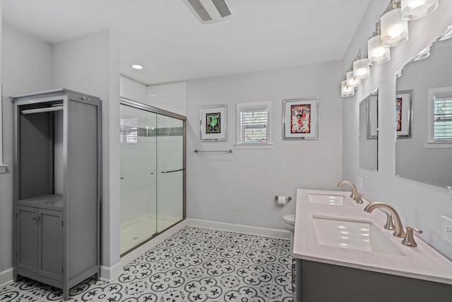 full bathroom with a sink, baseboards, and a wealth of natural light